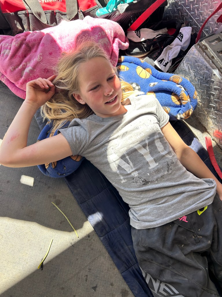 Liesel resting after her crash, smiling